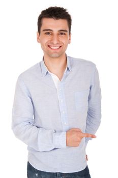 smiling young casual man pointing at something (isolated on white background)