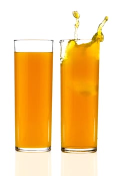 Two cups of orange juice over white reflective background.