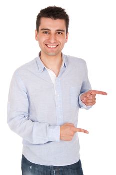 smiling young casual man pointing at something (isolated on white background)