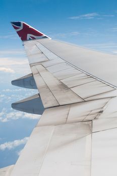 ST JOHNS, ANTIGUA - AUGUST 17: view of Boeing 747 wing of Virgin Atlantic Airways with blue sky clouds close to V. C. Bird International Airport in Antigua on August 17, 2011 in St. John's, Antigua