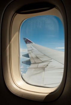 ST JOHNS, ANTIGUA - AUGUST 17: view of Boeing 747 wing of Virgin Atlantic Airways with blue sky clouds close to V. C. Bird International Airport in Antigua on August 17, 2011 in St. John's, Antigua