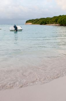 motor boat at a tropical beach in Willikies, Antigua (sunset picture with shallow DOF)