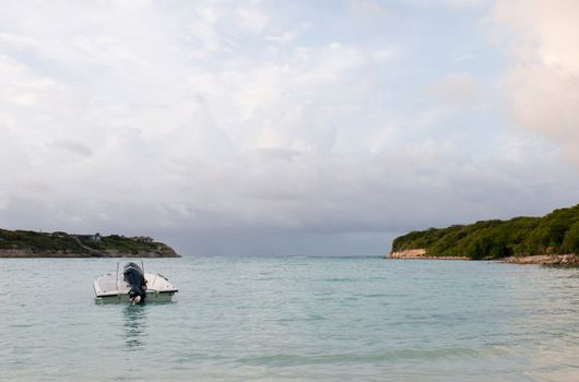 motor boat at a tropical beach in Willikies, Antigua (sunset picture)