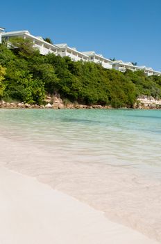 tropical beach and resort villas along the coast in Long Bay, Antigua