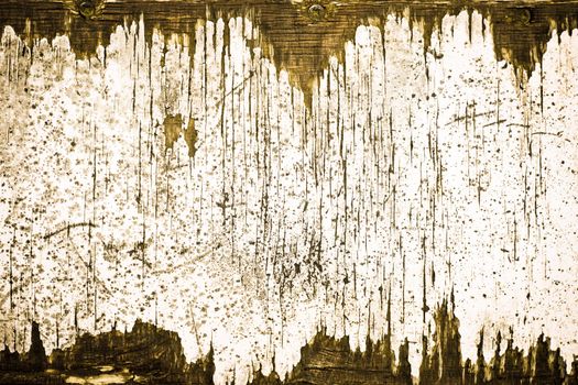An interesting pattern of peeling paint on old wood