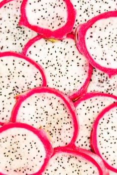 Sliced fresh dragon fruit as a detailed background image