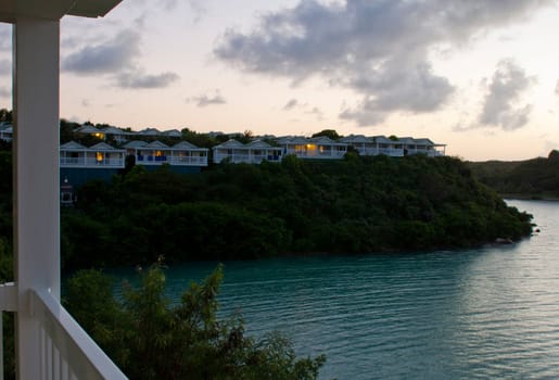 balcony view of Long Bay with resort villas and seascape in Antigua (sunset picture)