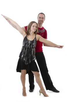 couple dancing salsa in the middle of a pose