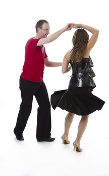 couple dancing salsa in the middle of a pose