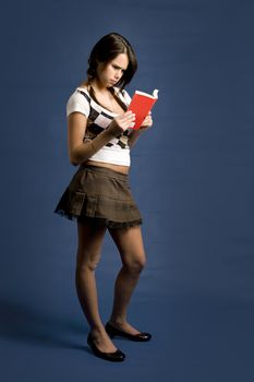 young women concentrating on reading a book