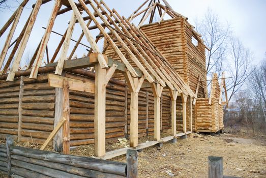 Unfinished, ecological wooden house and building area