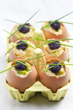 scrambled eggs with chives and black caviar