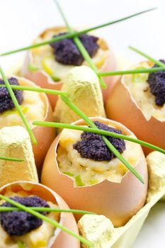 scrambled eggs with chives and black caviar