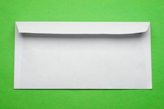 Envelope isolated on green