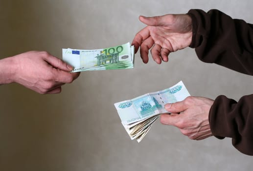 Two men exchange money. Giving money concept