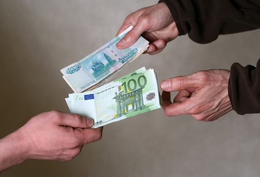 Two men exchange money. Giving money concept