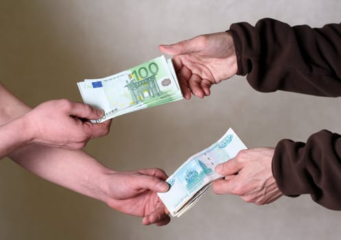 Two men exchange money. Giving money concept