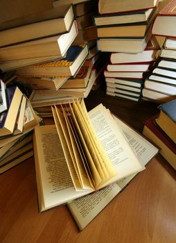 Many old books combined by a heap