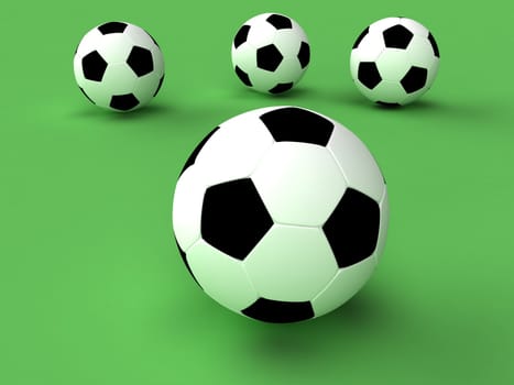 Some footballs on a green background