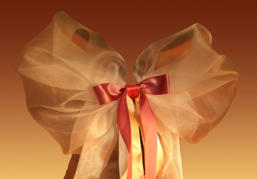 Red-yellow bow on a red-yellow background