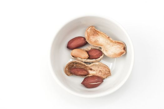 Peanuts close up in white bowl