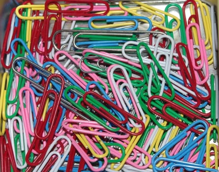 colored paperclips in box