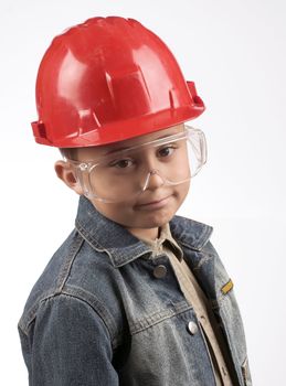 Portrait of a boy in a red protective helmet