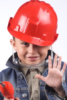 Portrait of a boy in a red protective helmet