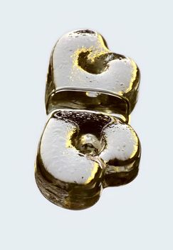 The image of glass heart with reflection in a smooth surface