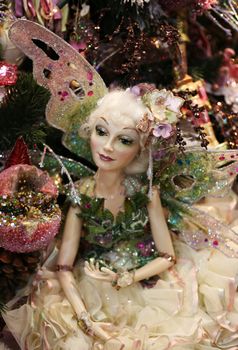 The doll - fairy with wings on a New Year tree