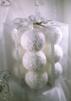 White christmas balls in a transparent box