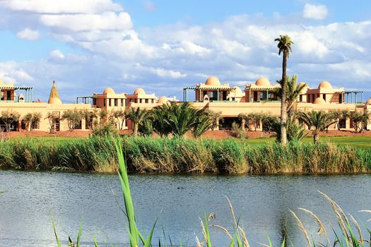 a view of a luxurious club house on a golf course of Marrakesh, Morocco