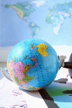 The globe lies on a world card