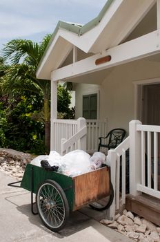 antique cleaning cart outside tropical resort villa (in the carribean)