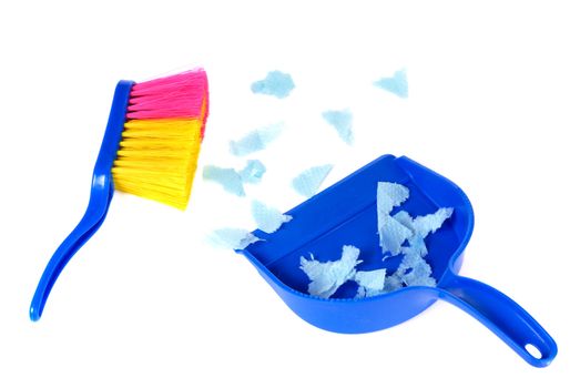 Brush and scoope with garbage isolated on white background