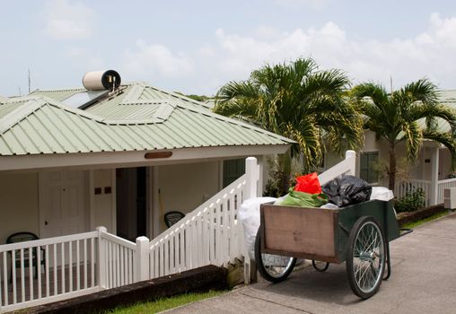 antique cleaning cart outside tropical resort villa (in the carribean)