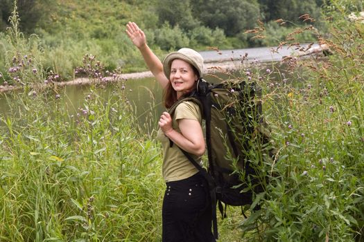 The woman the tourist on coast of the river