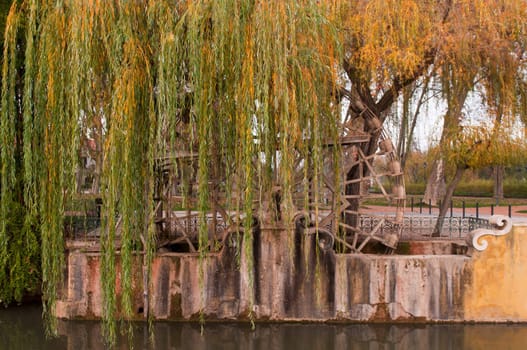 traditional watermill structure surrounded by trees in Tomar, Portugal