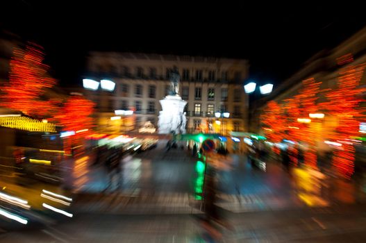abstract picture from moving traffic and car lights in the evening next to Luis Vaz de Cam�es square during Christmas time