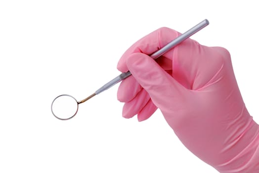 dental mirror in hand with a doctor in a pink glove