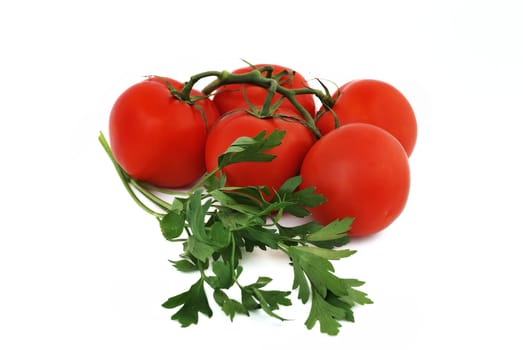 bunch of tomato and parsley on a white background