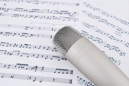 professional microphone and musical notes