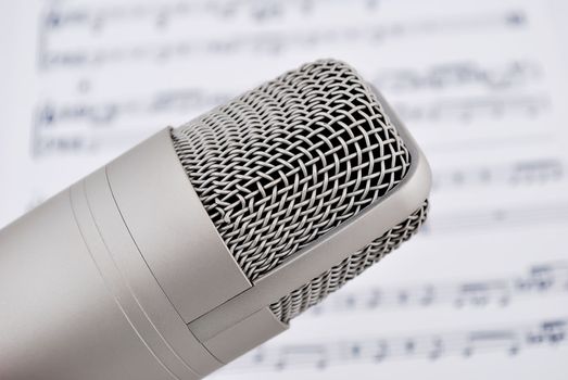 professional microphone and musical notes