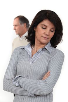 mature couple long-faced after quarrel