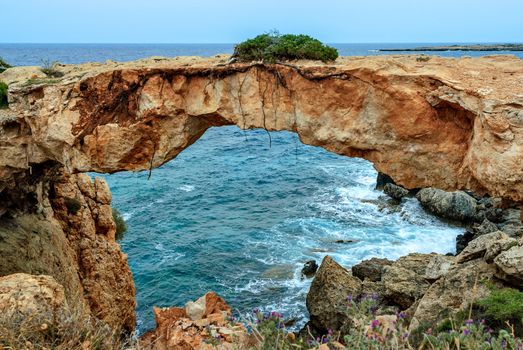 Stone arch over coastline on Cyrpus