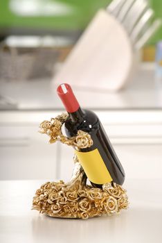 expensively gold holder for bottle of wine in the kitchen