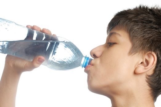 Half face of the boy drinking the mineral water on white background