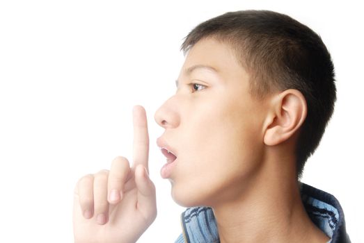 Photo of the boy telling secret and finger at his lips