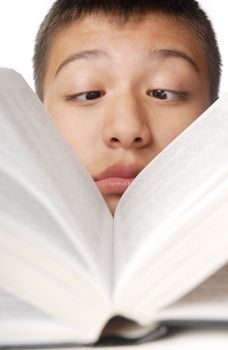Photo of the reading boy with big book