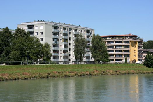 Salzach river and city residential architecture in Salzburg, Austria